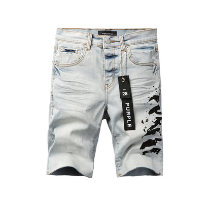 Men Streetwear Denim Shorts Light Blue Wash with Black Paint Streak Print and Raw Hem 5048