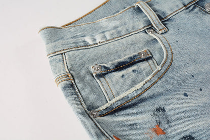 Men Streetwear Denim Shorts Light Blue Wash with Colorful Paint Splashes and Distressed Raw Hem 5071